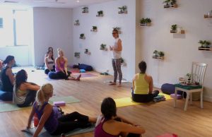 people seated in yoga studio